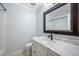 Clean bathroom featuring a large mirror over a marble top vanity at 115 Clubhouse Rd, Summerville, SC 29483