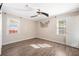 Neutrally decorated bedroom with a ceiling fan and two windows bringing in natural light at 115 Clubhouse Rd, Summerville, SC 29483