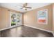 Cozy bedroom with two bright windows providing lots of natural light and hardwood floors at 115 Clubhouse Rd, Summerville, SC 29483