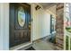Elegant front door featuring decorative glass, complemented by brick accents and a secure smart lock system at 115 Clubhouse Rd, Summerville, SC 29483