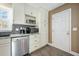 Close-up of kitchen featuring stainless steel appliances, gray backsplash, and granite countertops with a stainless steel sink at 115 Clubhouse Rd, Summerville, SC 29483