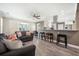 Open-concept living room with eat-in kitchen, breakfast bar, and lots of natural light at 115 Clubhouse Rd, Summerville, SC 29483