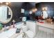 A black and white bathroom features modern fixtures, a sink, a toilet and updated lighting at 1158 Village Creek Ln # 3, Mount Pleasant, SC 29464