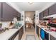 The kitchen has grey cabinets, white countertops, a refrigerator, a dishwasher, and a sink at 1158 Village Creek Ln # 3, Mount Pleasant, SC 29464