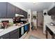 The kitchen has grey cabinets, white countertops, a refrigerator, and a stove/oven at 1158 Village Creek Ln # 3, Mount Pleasant, SC 29464