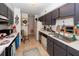 The kitchen has grey cabinets, white countertops, a refrigerator, a dishwasher, and a sink at 1158 Village Creek Ln # 3, Mount Pleasant, SC 29464