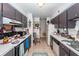 The kitchen has grey cabinets, white countertops, a refrigerator, and a stove/oven at 1158 Village Creek Ln # 3, Mount Pleasant, SC 29464