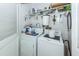 Functional laundry room with washer, dryer, and ample shelving for storage solutions at 1158 Village Creek Ln # 3, Mount Pleasant, SC 29464