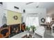 Cozy living room featuring a fireplace, plants, and natural light, creating a warm and inviting atmosphere at 1158 Village Creek Ln # 3, Mount Pleasant, SC 29464