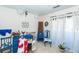 Eclectic living room featuring blue painted furniture, floral arrangements, and sheer curtains at 1158 Village Creek Ln # 3, Mount Pleasant, SC 29464