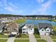 Aerial view of a community with lake and lush green spaces at 116 Rouen Ln, Summerville, SC 29486