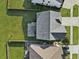 Aerial view of a well-maintained home with a gray roof and a spacious backyard in a suburban neighborhood at 116 Rouen Ln, Summerville, SC 29486