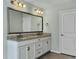 Bathroom with double vanity, granite countertops and stylish fixtures at 116 Rouen Ln, Summerville, SC 29486