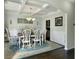 Dining room with coffered ceiling, hardwood floors, and wainscoting at 116 Rouen Ln, Summerville, SC 29486
