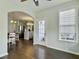 View from dining room looking into kitchen, stainless steel appliances, gray cabinets, and hardwood flooring at 116 Rouen Ln, Summerville, SC 29486
