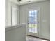 Hallway featuring an exterior door, neutral paint, and wall to wall carpeting at 116 Rouen Ln, Summerville, SC 29486