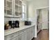 Kitchen with grey cabinets, quartz countertop, and subway tile backsplash at 116 Rouen Ln, Summerville, SC 29486
