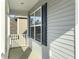 Covered porch with view of adjacent building at 116 Rouen Ln, Summerville, SC 29486