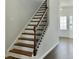Elegant staircase with wood treads, white risers, and decorative wrought iron spindles at 116 Rouen Ln, Summerville, SC 29486