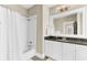Bathroom featuring a shower/tub combo, a vanity with great storage, and bright lighting at 1429 Lettered Olive Ln, Mount Pleasant, SC 29464