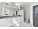 Modern bathroom with marble walk-in shower, granite countertop, and double sink vanity at 1429 Lettered Olive Ln, Mount Pleasant, SC 29464