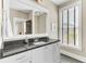 Neutral bathroom featuring a vanity with great storage and plenty of natural light at 1429 Lettered Olive Ln, Mount Pleasant, SC 29464
