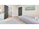 Bedroom with two twin beds and a view of another living space through gray doors at 1429 Lettered Olive Ln, Mount Pleasant, SC 29464