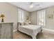Comfortable bedroom featuring warm tones, neutral decor, and large bright windows at 1429 Lettered Olive Ln, Mount Pleasant, SC 29464