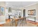 Bright dining area with pendant lighting, hardwood floors, and seamless access to the kitchen for easy entertaining at 1429 Lettered Olive Ln, Mount Pleasant, SC 29464