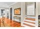 Entryway with hardwood floors, staircase, and artwork at 1429 Lettered Olive Ln, Mount Pleasant, SC 29464