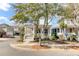 Charming two-story home with a welcoming porch and a beautifully landscaped front yard at 1429 Lettered Olive Ln, Mount Pleasant, SC 29464