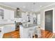 Bright kitchen with white cabinets, stainless steel appliances, and granite countertops at 1429 Lettered Olive Ln, Mount Pleasant, SC 29464