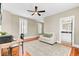 Comfortable living room space featuring hardwood floors and a neutral color palette at 1429 Lettered Olive Ln, Mount Pleasant, SC 29464