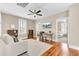 Inviting living room with hardwood floors, a ceiling fan, and plenty of natural light at 1429 Lettered Olive Ln, Mount Pleasant, SC 29464