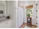 Bright bathroom with a modern sink, a natural light, and a decorative cabinet at 1456 Mcpherson Lndg, Johns Island, SC 29455
