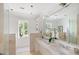 Bright bathroom with a double vanity, a large mirror, and a window with green outdoor views at 1456 Mcpherson Lndg, Johns Island, SC 29455