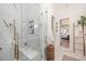 Modern bathroom with a marble walk-in shower, gold fixtures, and elegant decor at 1456 Mcpherson Lndg, Johns Island, SC 29455