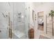 Modern bathroom with a marble walk-in shower, gold fixtures, and elegant decor at 1456 Mcpherson Lndg, Johns Island, SC 29455