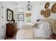 Bright bedroom featuring a comfortable bed, stylish decor, and a window with a view of the yard at 1456 Mcpherson Lndg, Johns Island, SC 29455