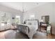 Bright bedroom with a wrought iron bed, white linens, and French doors at 1456 Mcpherson Lndg, Johns Island, SC 29455
