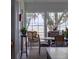 Inviting dining area with large windows offering scenic views of the marsh and mature oak trees at 1456 Mcpherson Lndg, Johns Island, SC 29455