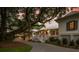 Beautifully landscaped home exterior with a long drive, mature trees, and a classic design at 1456 Mcpherson Lndg, Johns Island, SC 29455