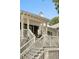 Charming covered front porch featuring white railing, columns, and stairs with a beautiful landscaped approach at 1456 Mcpherson Lndg, Johns Island, SC 29455