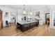 Spacious kitchen with a large center island, marble countertops, stainless steel appliances, and custom cabinets at 1456 Mcpherson Lndg, Johns Island, SC 29455