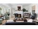 Bright and airy living room with a fireplace, comfortable seating and decor, and a view to a bedroom at 1456 Mcpherson Lndg, Johns Island, SC 29455