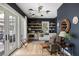 This charming living room features a workstation, stainless appliances, and a view of the backyard at 1456 Mcpherson Lndg, Johns Island, SC 29455