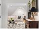 Cozy living room showcasing an off-white couch and black-and-white patterned rug at 1456 Mcpherson Lndg, Johns Island, SC 29455