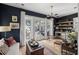 Living room with stylish wet bar and doors leading to the pool deck, showcasing seamless indoor-outdoor living at 1456 Mcpherson Lndg, Johns Island, SC 29455