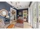 Cozy living room with stylish lighting, comfortable seating, and access to the main bedroom at 1456 Mcpherson Lndg, Johns Island, SC 29455