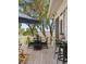 Outdoor dining area on a wooden deck, perfect for enjoying meals with a scenic view at 1456 Mcpherson Lndg, Johns Island, SC 29455